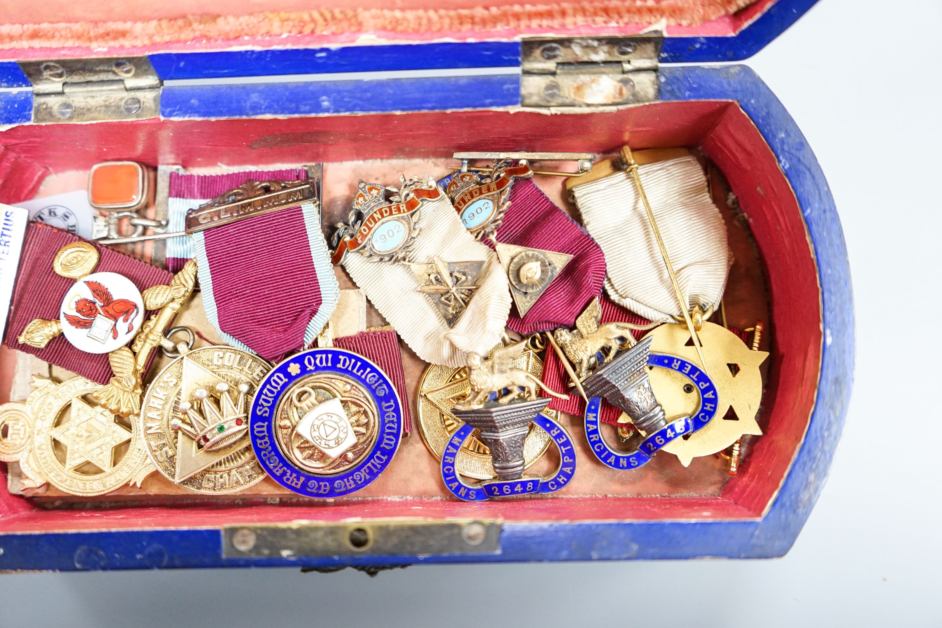 A group of Masonic medals some silver gilt, in a painted wood box